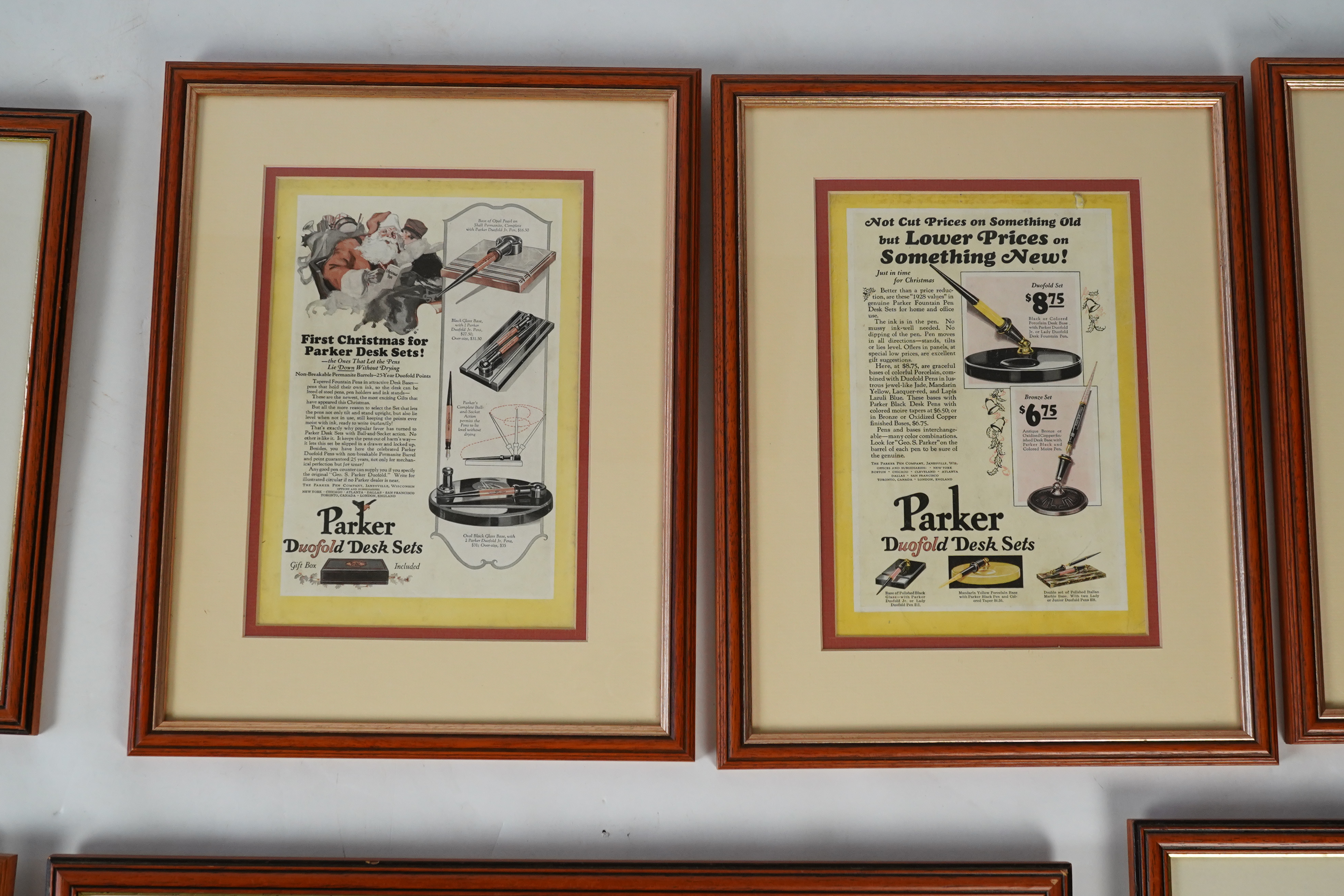 Framed fountain pen adverts (12)